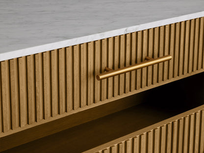 Finnley Five-Drawer Dresser: honey oak reeded front, white stone top, 5 brass bar handles, angled brass legs.