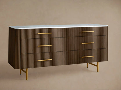 Finnley Six-Drawer Dresser: Mocha wood with vertical reeding, white stone top, six brass handles, and gold legs.