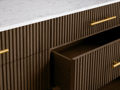 Finnley Six-Drawer Dresser: Dark brown wood with vertical reeding detail, white stone top, 6 gold bar pulls, angled gold legs.