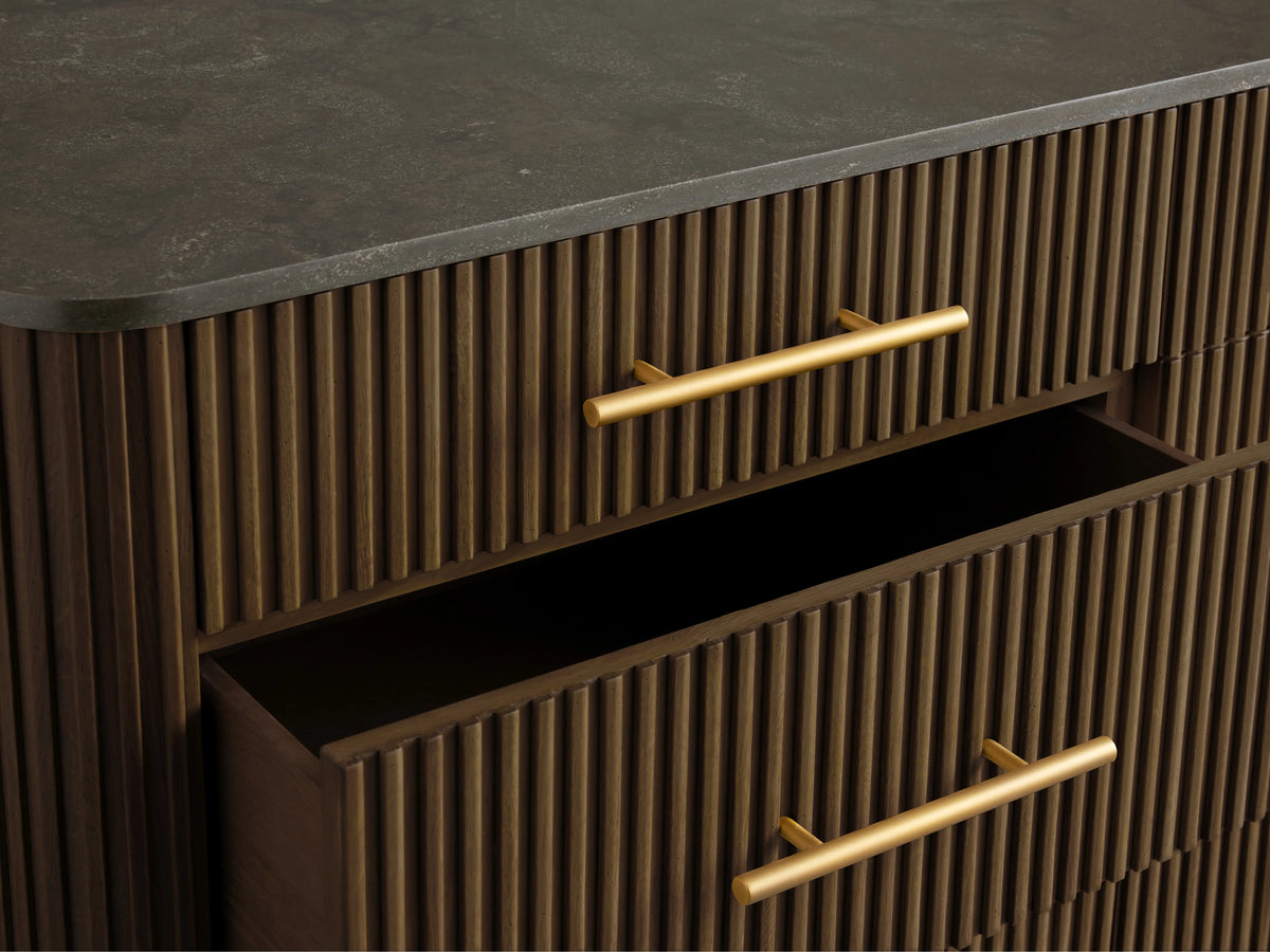 Finnley Nine-Drawer Dresser in dark wood with brass-finished handles; three drawers open, showcasing sleek design and a dark top surface.