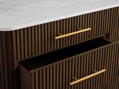 Finnley Nine-Drawer Dresser in dark wood with vertical grooves, brass-finished handles, and white marble top; two drawers open.
