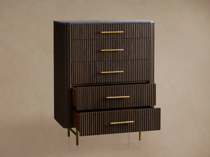 Finnley Five-Drawer Dresser in dark ebony with vertical reeding, brass pulls, dark stone top. Two bottom drawers are open. Gold angled legs.