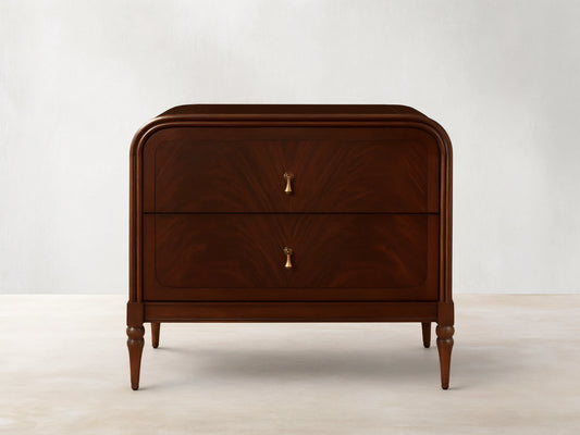 Frances Nightstand, dark brown figured mahogany wood with rounded corners, two drawers, and vintage brass hardware.
