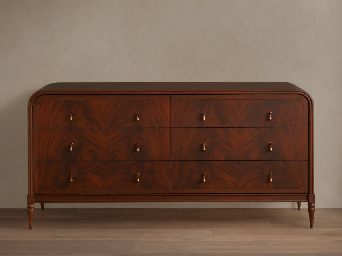 Frances Six-Drawer Dresser: Dark mahogany wood with flame-like grain, 6 drawers, brass knobs, rounded top, tapered legs.