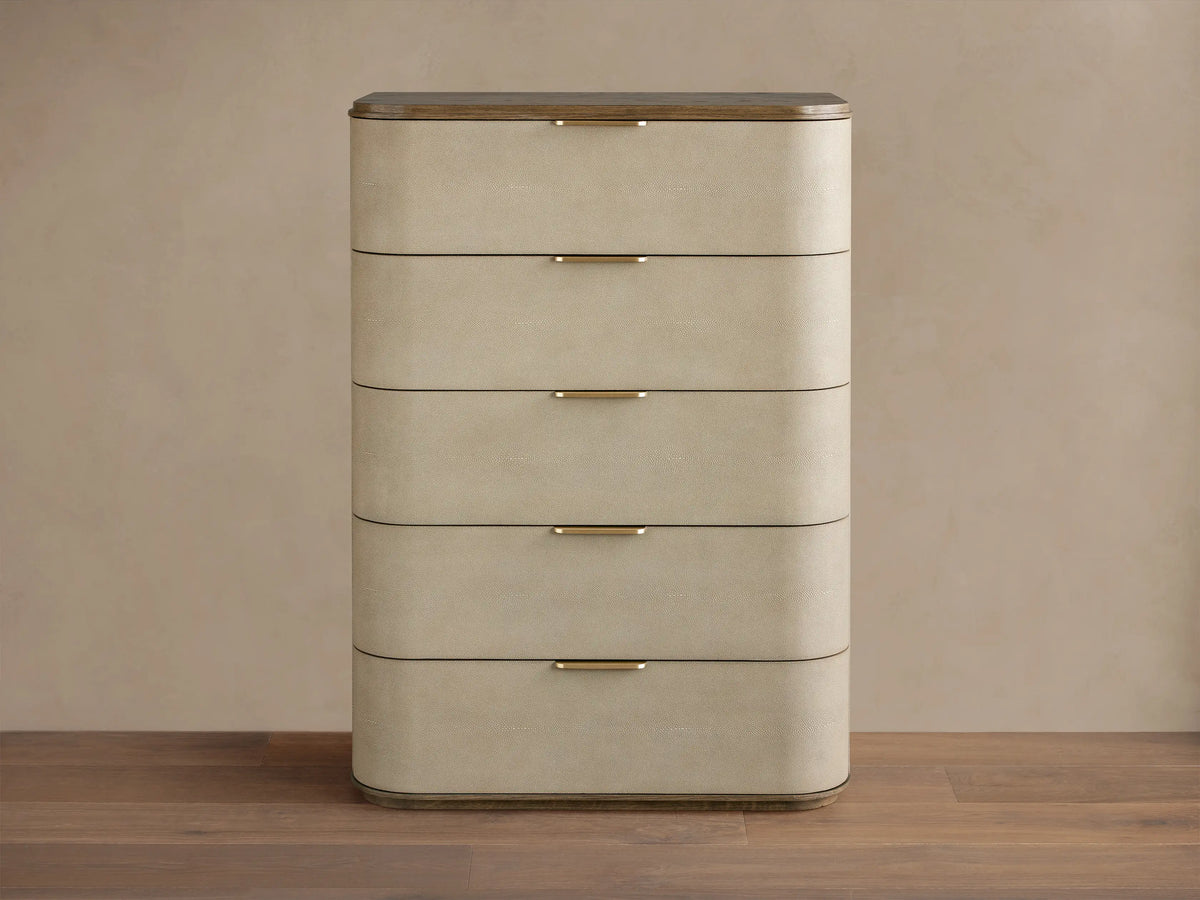 Harrow Five-Drawer Dresser with rounded, light beige faux shagreen drawers, dark wood top, and brass hardware.