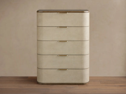 Harrow Five-Drawer Dresser with rounded, light beige faux shagreen drawers, dark wood top, and brass hardware.