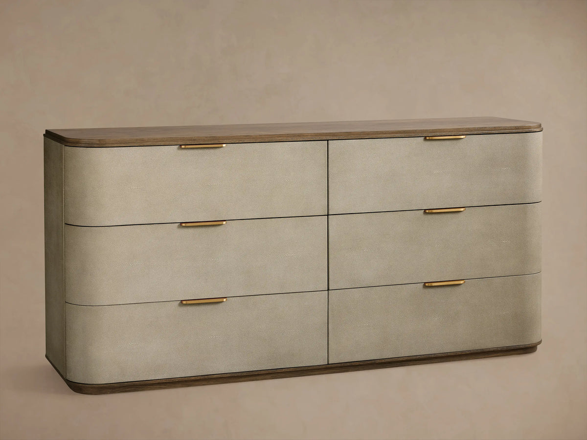 Harrow Dresser: Close-up of two drawers. Top closed, bottom partially open. Light gray textured faux shagreen, brass pulls, dark wood.