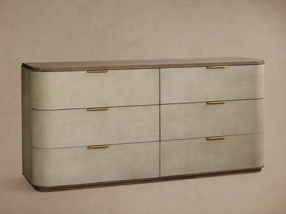 Harrow Dresser: Close-up of two drawers. Top closed, bottom partially open. Light gray textured faux shagreen, brass pulls, dark wood.