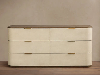 Harrow Six-Drawer Dresser with light grey faux shagreen finish, natural wood top, and six champagne-brass pull handles.