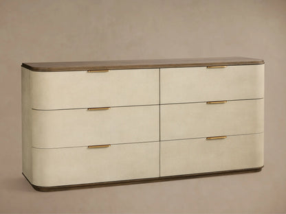 Harrow Six-Drawer Dresser: Light beige faux shagreen dresser with 6 drawers, rounded corners, gold hardware, dark wood top and base.