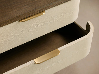 Harrow Six-Drawer Dresser: Light beige faux shagreen dresser with six drawers, dark wood top/base, and gold bar pulls.