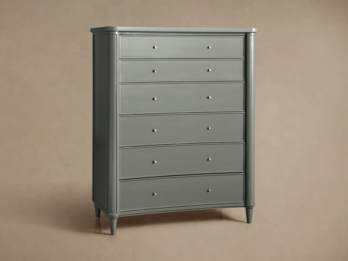 Henley Six-Drawer Dresser in smooth gray finish with petite brass pulls, featuring a classic rectangular silhouette and tapered legs.
