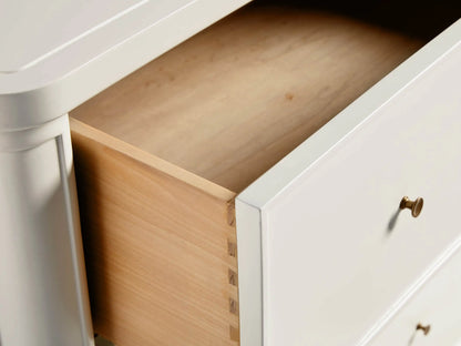 Henley Wide Six-Drawer Dresser in white with six spacious drawers, petite brass pulls, and a sleek lacquer finish.