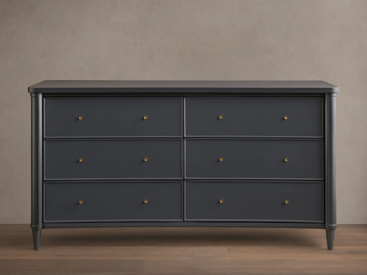 Front view of the Charcoal Henley Wide Six-Drawer Dresser, featuring six drawers with petite brass pulls.