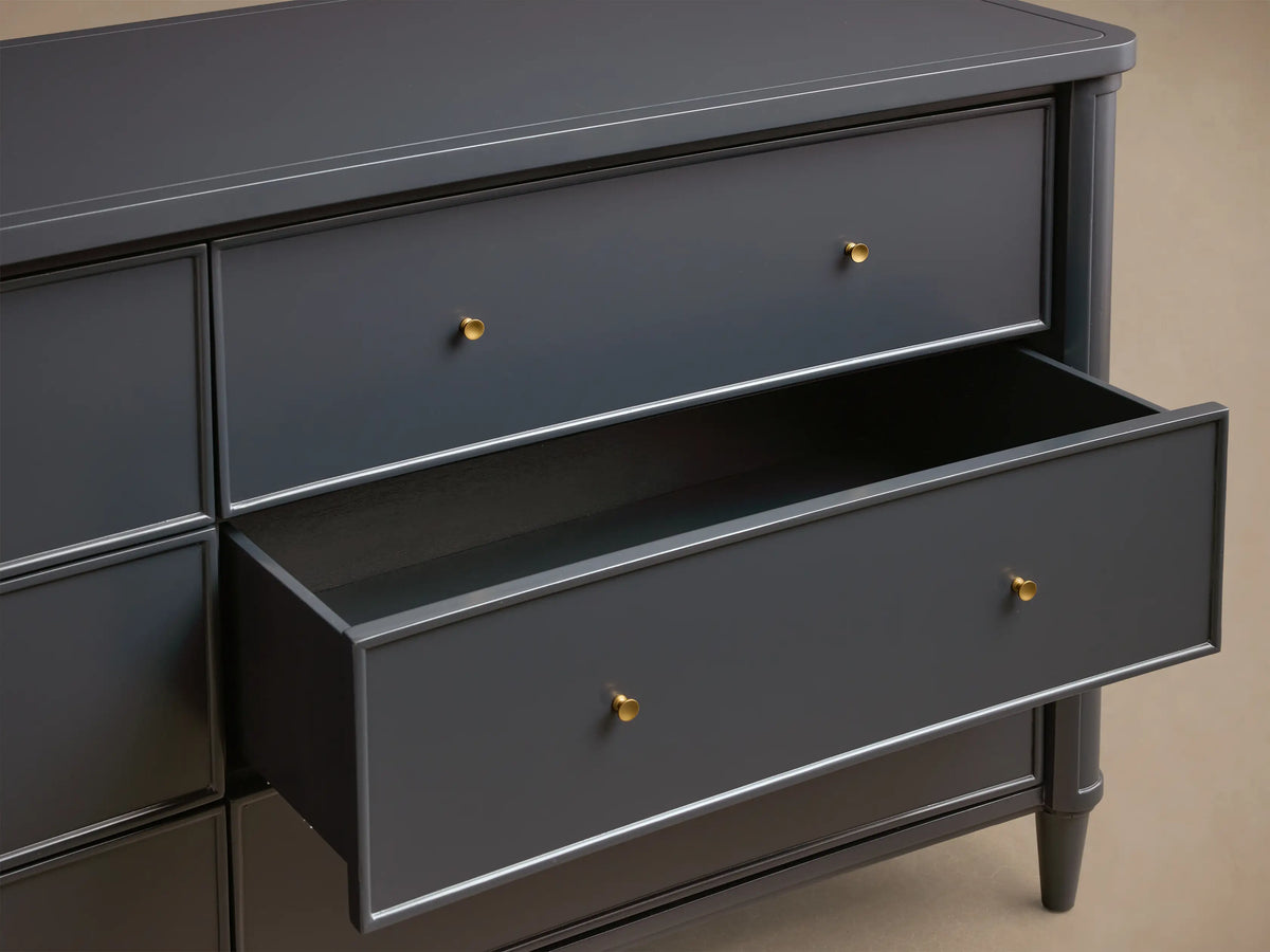 Front view of the dark gray Henley Wide Six-Drawer Dresser, featuring six drawers with petite brass pulls.
