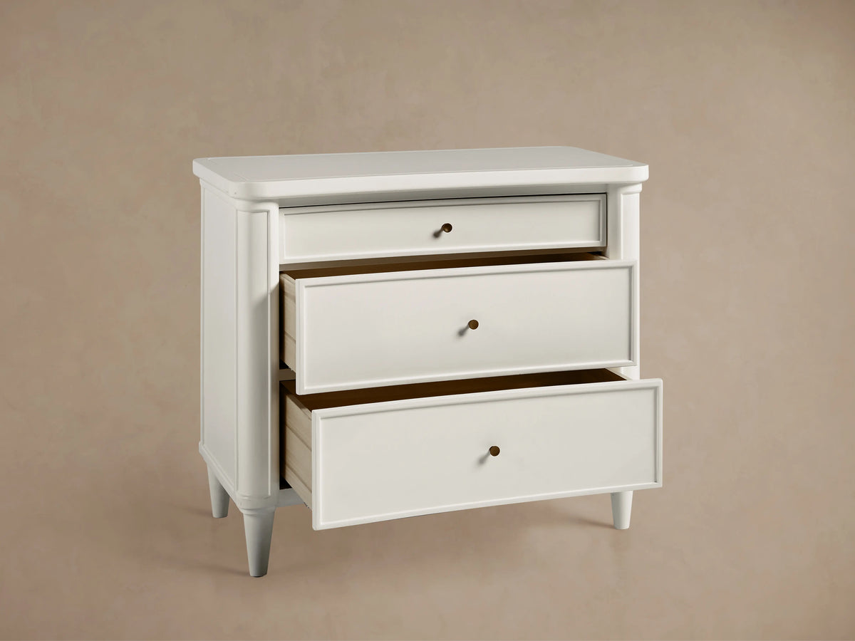 Henley Nightstand in white with smooth finish, featuring a brass knob and an open drawer showing light wood interior.