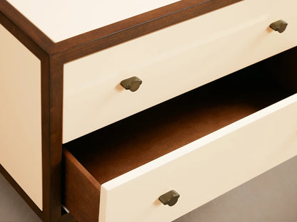 Henton Nightstand: dark brown frame, cream side & 2 drawers w/ brass knobs. Slim bronze-gold metal legs. Angled view on wood floor.