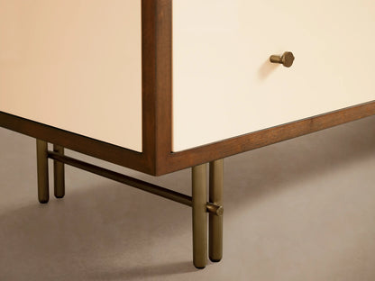 Close-up of Henton Six-Drawer Dresser with a partially open off-white drawer revealing dark wood interior and brass knob.