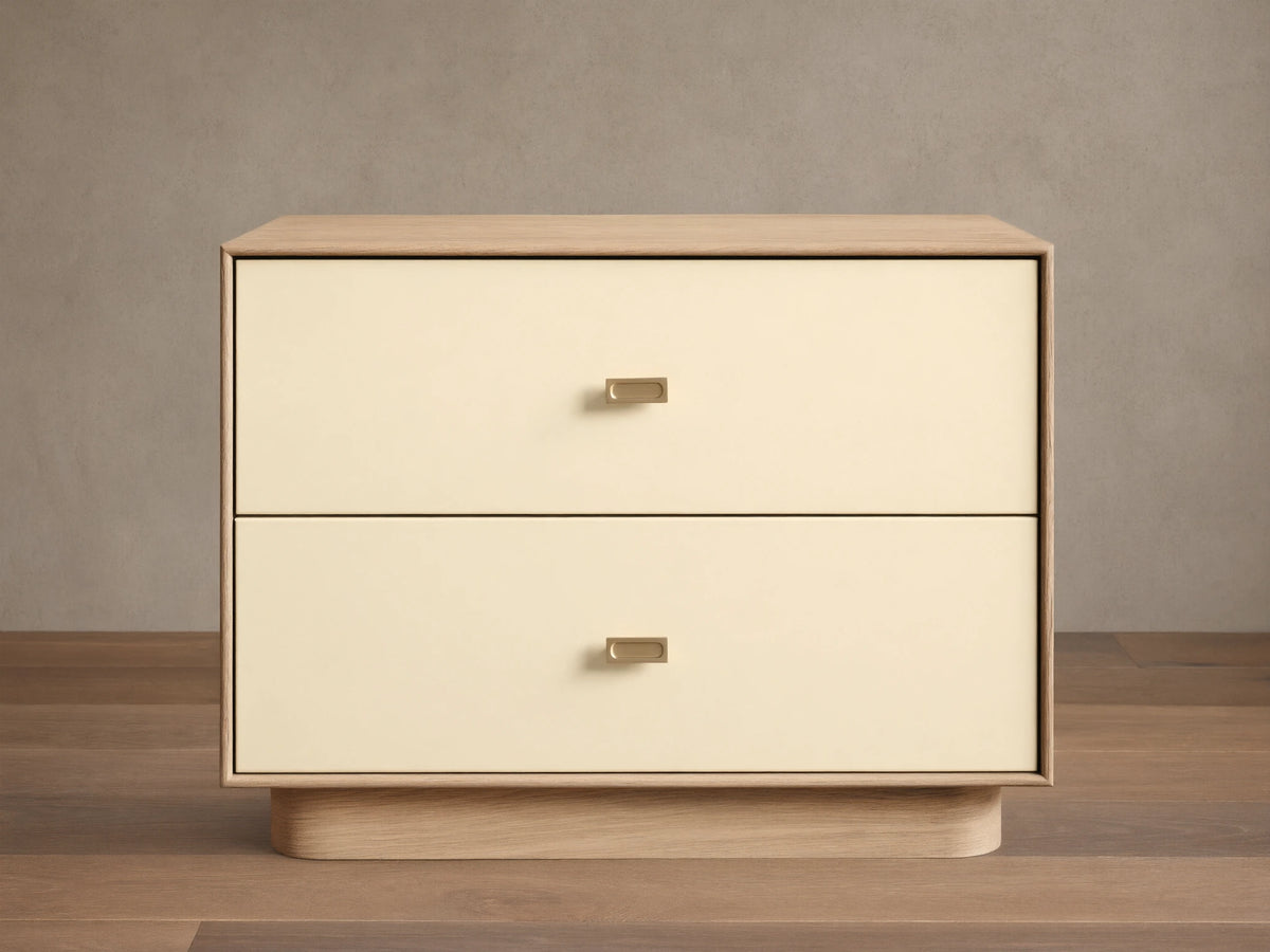 Front view of the Oak Lowen Nightstand, featuring two parchment faux leather drawers with champagne brass pulls.