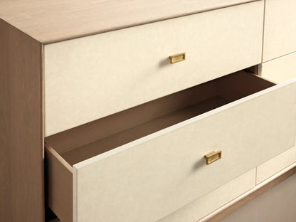 Front view of the Lowen Six-Drawer Dresser, featuring a light oak wood veneer frame and six cream faux leather drawers with brass pulls.