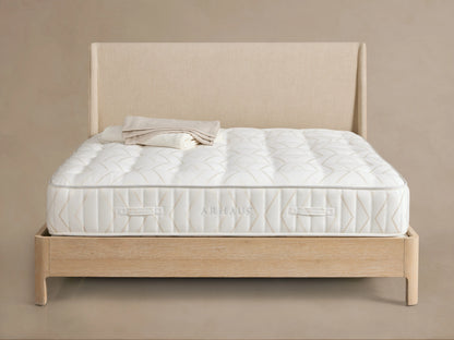 Luxury Firm Mattress side view, showing beige geometric patterns on a white fabric with stitched horizontal handles and detailed edging.