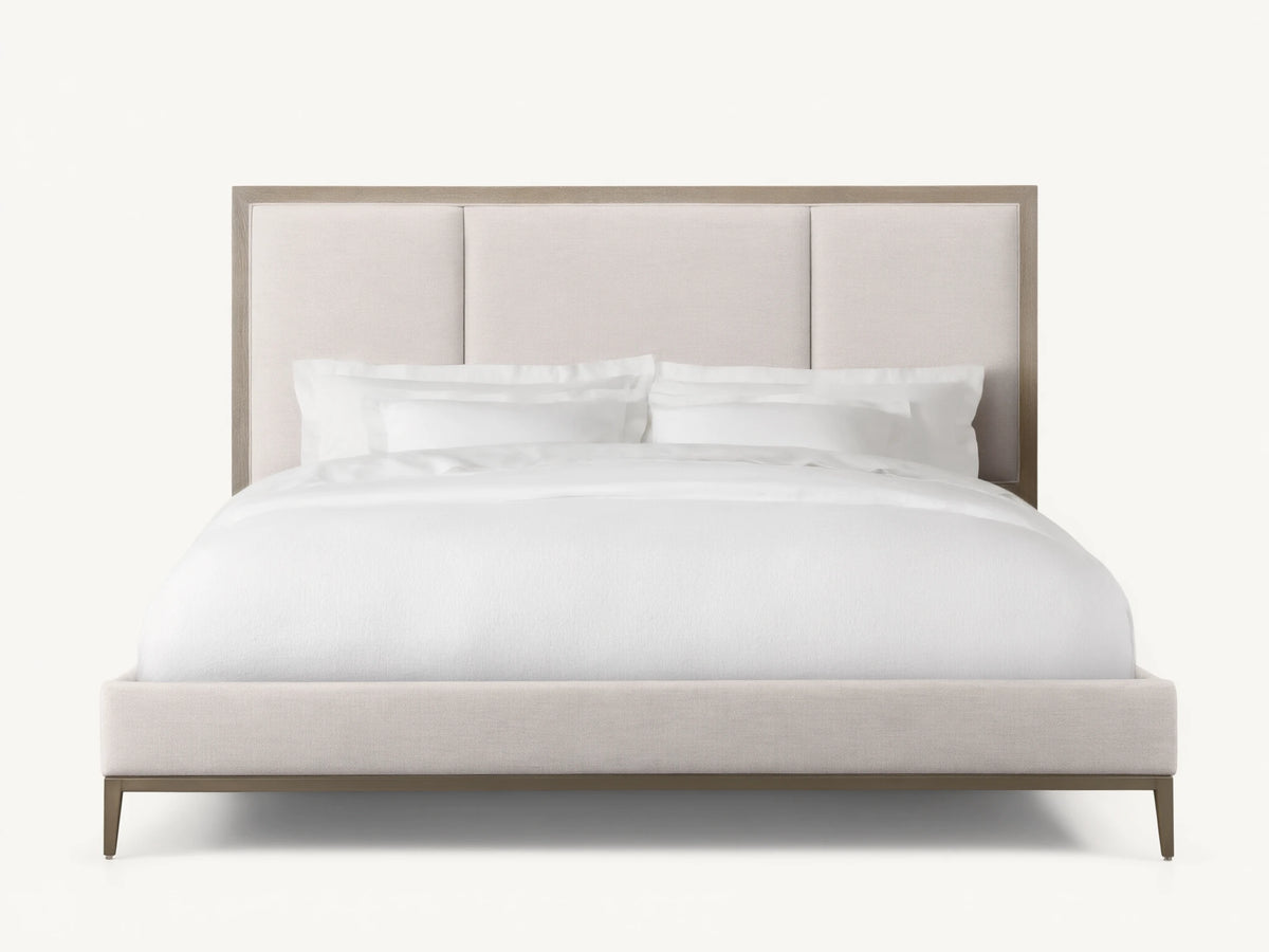 Malone Upholstered Bed in neutral tones, featuring a headboard with three channel-stitched panels, white bedding, and wood frame.
