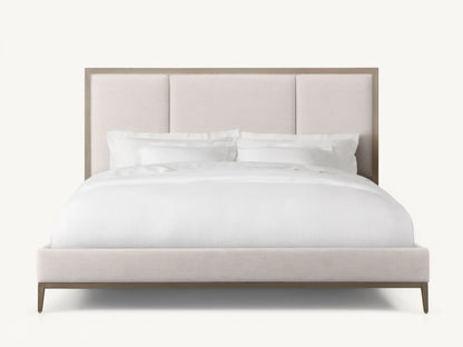Malone Upholstered Bed in neutral tones, featuring a headboard with three channel-stitched panels, white bedding, and wood frame.