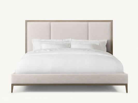Malone Upholstered Bed in neutral tones, featuring a headboard with three channel-stitched panels, white bedding, and wood frame.