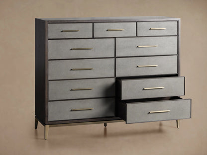 Close-up of Malone Eleven-Drawer Dresser. Dark wood frame, dark gray shagreen-embossed drawers with horizontal brass bar pulls.