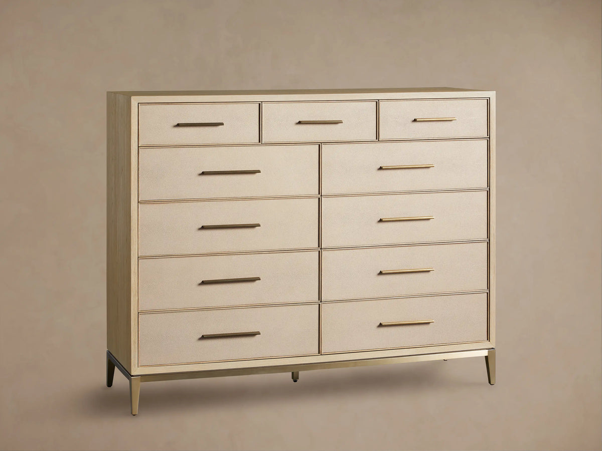 Front view of the Bone Malone Eleven-Drawer Dresser with textured shagreen drawer fronts, metallic gold handles, and base.