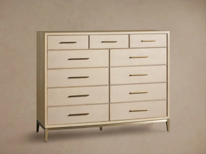 Front view of the Bone Malone Eleven-Drawer Dresser with textured shagreen drawer fronts, metallic gold handles, and base.