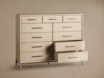 Front view of the Bone Malone Eleven-Drawer Dresser with shagreen detailing, gold handles, and two bottom drawers partially open.