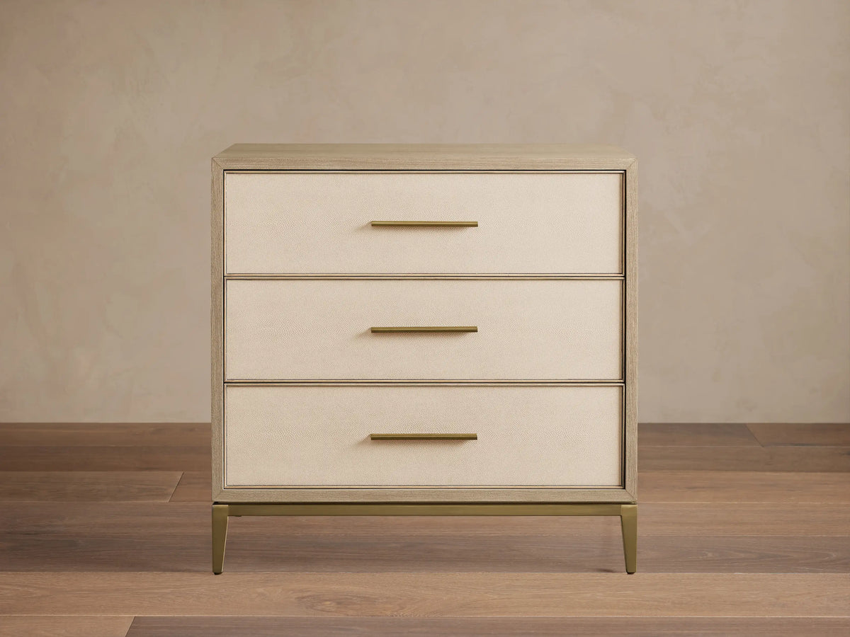 Malone Three-Drawer Chest in bone/manta, elm wood veneer frame, cream textured shagreen leather drawers, gold pulls & base.