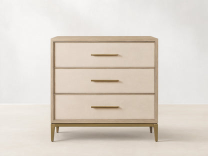 Malone Three-Drawer Chest in bone/manta, elm wood veneer frame, cream textured shagreen leather drawers, gold pulls & base.