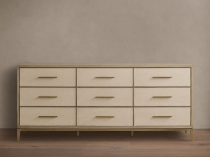 Front view of the Bone Malone Nine-Drawer Dresser, featuring nine drawers with embossed shagreen faces and metallic bar handles.