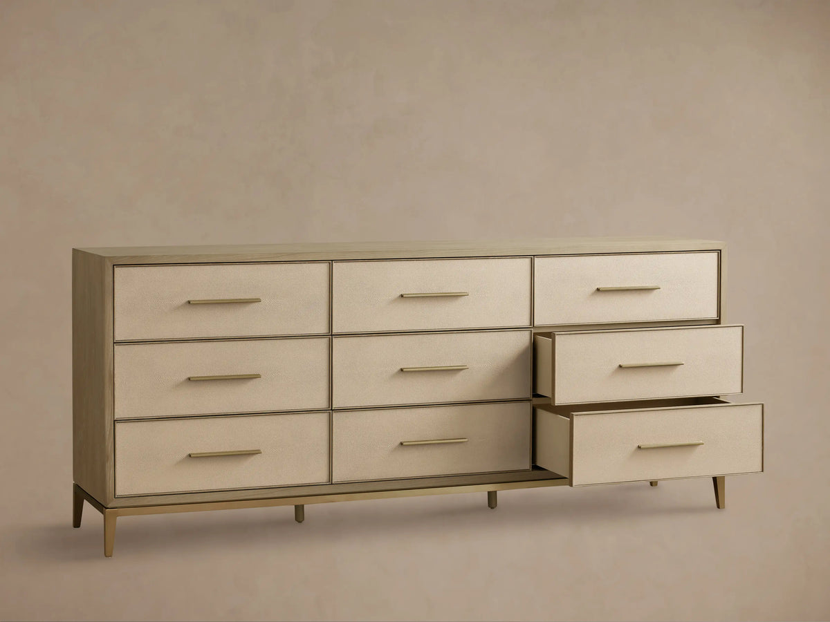 Front view of the Bone Malone Nine-Drawer Dresser, featuring nine drawers with embossed shagreen faces and metallic bar handles.
