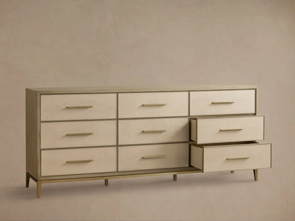 Front view of the Bone Malone Nine-Drawer Dresser, featuring nine drawers with embossed shagreen faces and metallic bar handles.