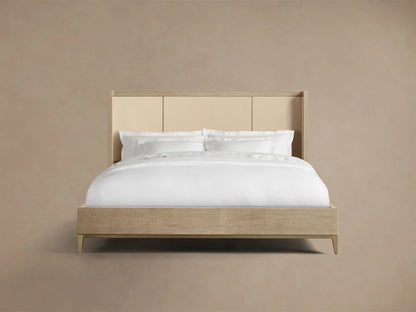 Front view of the Bone Malone Shelter Bed with solid oak, elm veneers, shagreen reconstituted leather panels, and white bedding.