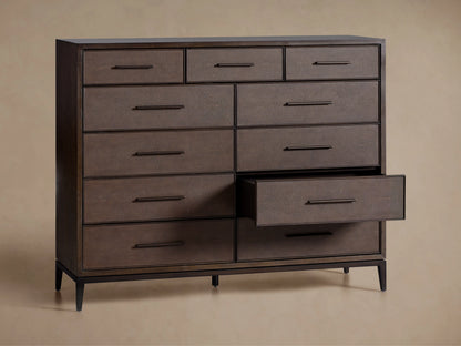Malone Eleven-Drawer Dresser in dark wood finish with horizontal handles. Embossed leather insets and metallic accents, set on wooden legs.