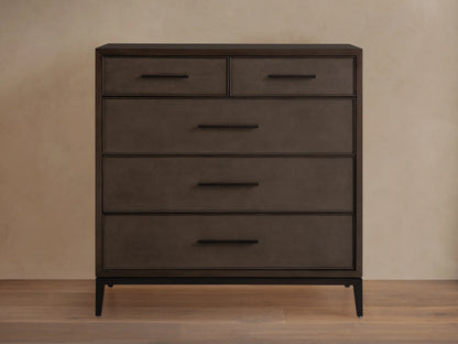 Malone Five-Drawer Dresser in dark wood finish with five drawers, featuring metal handles and a sleek, rectangular design on a wooden floor.