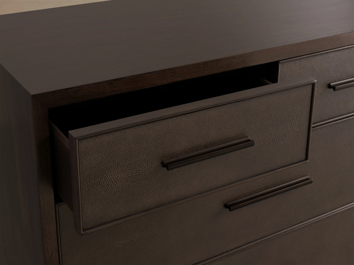 Malone Five-Drawer Dresser in dark wood finish with five drawers, featuring metal handles and a sleek, rectangular design on a wooden floor.