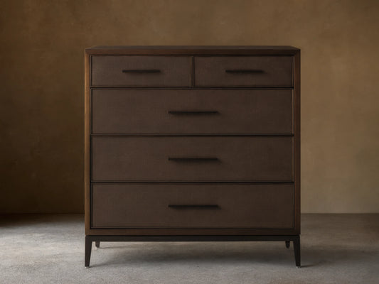Malone Five-Drawer Dresser in dark wood finish with five drawers, featuring metal handles and a sleek, rectangular design on a wooden floor.