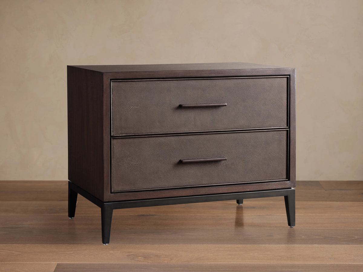 Malone Closed Nightstand with two drawers, dark wood finish, textured leather fronts, and sleek black handles; stands on tapered legs.