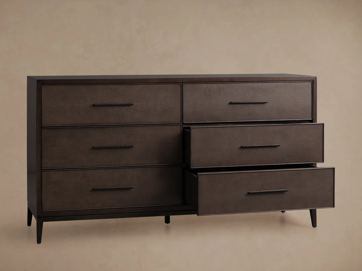 Malone Six-Drawer Dresser in dark wood finish shown with an open top drawer featuring a textured surface and a sleek metallic handle.
