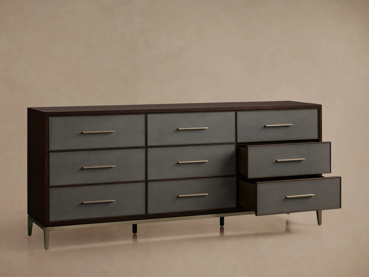 Malone Nine-Drawer Dresser in dark wood with gray drawer fronts, featuring metallic handles. Three drawers are partially open.
