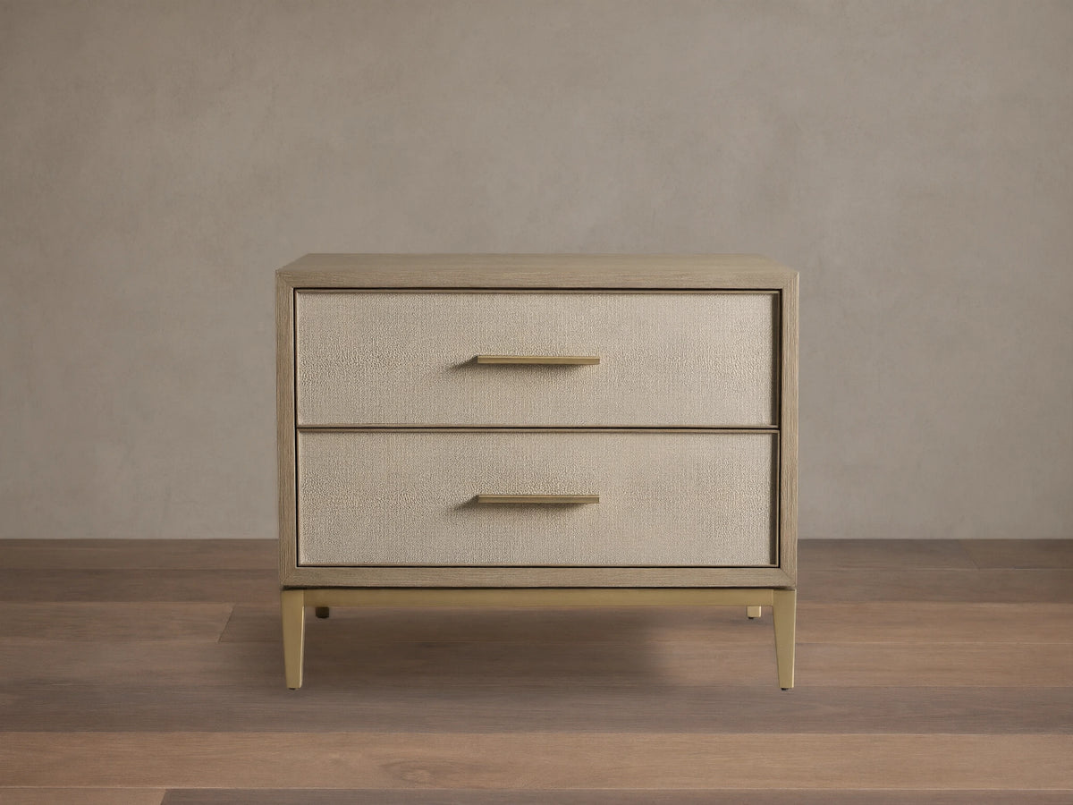 Front view of the Bone Malone Closed Nightstand with two cream shagreen leather drawers and brass hardware.