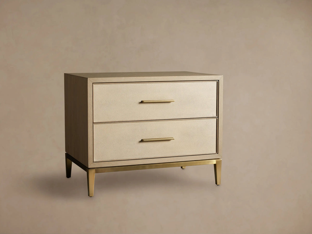 Front view of the Bone Malone Closed Nightstand with two cream shagreen leather drawers and brass hardware.