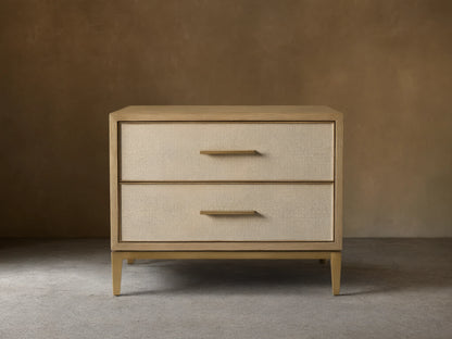 Front view of the Bone Malone Closed Nightstand with two cream shagreen leather drawers and brass hardware.