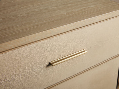 Front 3/4 view of the Bone Malone Closed Nightstand, featuring two drawers with shagreen-textured fronts and metallic gold hardware.