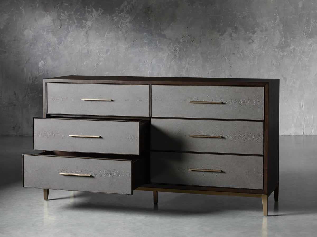 Front view of the dark brown Malone Six-Drawer Dresser with gray shagreen fronts and warm metallic pulls. Two left drawers are open.
